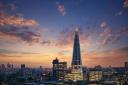 Tower Bridge and the skyline of London, just after sunset