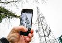 A mobile phone next to a telecoms mast near Dundry, Somerset (Ben Birchall/PA)