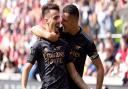 Arsenal’s Fabio Vieira celebrates scoring their third goal at Brentford with Granit Xhaka