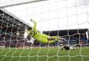 Arsenal goalkeeper David Raya saves a shot on goal from Aston Villa's Ollie Watkins (right) during the Premier League match at Villa Park, Birmingham. Picture date: Saturday August 24, 2024.