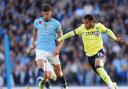 Ruben Dias (left) helped Manchester City to a narrow win over Southampton (Martin Rickett/PA).