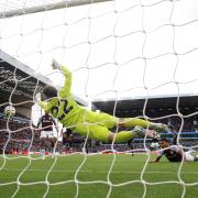 Arsenal goalkeeper David Raya saves a shot on goal from Aston Villa's Ollie Watkins (right) during the Premier League match at Villa Park, Birmingham. Picture date: Saturday August 24, 2024.