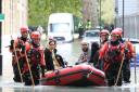 A family being rescued from the floods in Clapton on Wednesday morning. Picture: Paul Wood