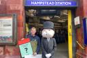 John Keen-Tomlinson, custom games executive at Winning Moves UK, with the Monopoly man at Hampstead Station