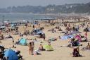 People enjoying the sunny weather on Bournemouth Beach in Dorset (Andrew Matthews/PA)