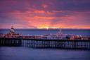 The pier will be lit in red and blue