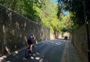 A cyclist taking on Swain's Lane, Highgate