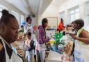 Hard working volunteers from Hackney charity Children With Voices sort supplies at one of its food hubs.