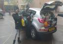 Students Lima Dias Fernandes Karen and Meya Holly help drop the collected food off at Hackney Foodbank.