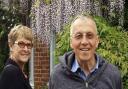 Malcolm and Linda Grove at their home in Belsize Lane under the wisteria they planted together.