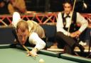 Former world snooker champion Steve Davis, of England takes his next shot as he partners Alex Lely (pictured) during their victory over USA