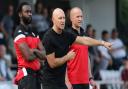 Hornchurch manager Mark Stimson (centre)