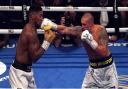 Oleksandr Usyk strikes Anthony Joshua in the WBA, WBO, IBF and IBO World Heavyweight titles match at the Tottenham Hotspur Stadium.