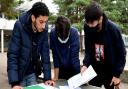 Akram Moubtassim, Jurayd Hussain and Lawrence Shao Huan Chong assess the GCSE results at Haverstock School