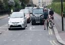 Traffic and cyclists coming out of Regent's Park outer circle