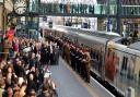 100 serving and veteran military personnel line the platform as the specially liveried Class 91 locomotive For The Fallen arrives at the paltform before a short remembrance service. Picture: Polly Hancock