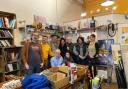 Staff at Second Chance, (l-r) Baris, Russell , Peter, Chaya, Basil, Sandra and Rebecca. Seated are Johnny and Ann