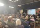 A hall full of Highgate villagers attend meeting about Highgate School plan