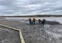 The partially drained Welsh Harp Reservoir