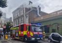 Smoke pours from a ventilation flue during a fire at the Parakeet pub in Kentish Town