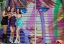 Swifties pose on Wembley Park's Taylor Swift steps during one of the Era's tour concerts this summer