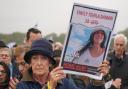 Emily Damari's image was on placards as people attend a Remembering October 7 memorial event in Hyde Park