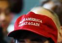 Two American passengers have been removed from a London Heathrow plane after a fight broke out over them wearing Trump MAGA hats.