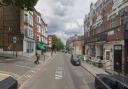 A road was closed and a forensics tent was put up after a man died in the street near a pub between Kilburn and West Hampstead.