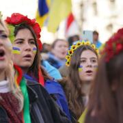 Women take part in a demonstration in Whitehall against the Russian invasion of Ukraine