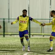 David Olufemi of Haringey Borough scores the first goal for his team and celebrates with his team mates