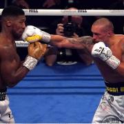 Oleksandr Usyk strikes Anthony Joshua in the WBA, WBO, IBF and IBO World Heavyweight titles match at the Tottenham Hotspur Stadium.