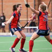 Emily Douglas and Esme Burge of Hampstead and Westminster celebrate a goal against Wimbledon