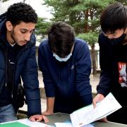 Akram Moubtassim, Jurayd Hussain and Lawrence Shao Huan Chong assess the GCSE results at Haverstock School