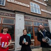 Landlords Ben Martin (left) and Tom Rees with local resident Polly Amos Robertson in front of the soon to be opened Carlton Tavern