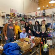 Staff at Second Chance, (l-r) Baris, Russell , Peter, Chaya, Basil, Sandra and Rebecca. Seated are Johnny and Ann