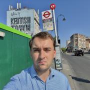 Cllr James Slater next to the bus stop in Kentish Town which will be closed for two years