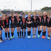 Haringey celebrate success in the girls hockey competition.