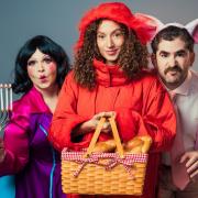 Debbie Chazen as Dame Hoodman, Gemma Barnett as Red and Josh Glanc as The Pig in Little Red Riding Hood and The Big Bad Pig. Image: Oliver Rosser