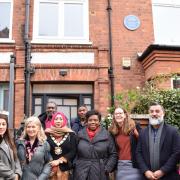 Mayor of Camden Cllr Nazma Rahman, councillors, Camden officers and Dr Jak Beula standing in front of the plaque in honour of Claudia Jones