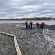 The partially drained Welsh Harp Reservoir