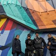 Street artist Pref, alongside students Aleksandra Yordanova, Harvey Wheeler-Barnes, and Ilyas Mahir