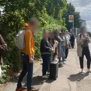 People patiently waiting for a replacement bus at Colindale Gardens on June 14 at 10.56am