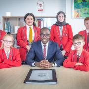 City of London Academy Highgate Hill head teacher Prince Gennuh and pupils celebrate the school’s new ‘good’ Ofsted rating. Image: Jamie Smith