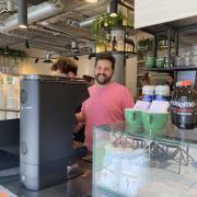 Alex Stone behind the counter at Trade Made in Swain's Lane