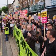 Anti-racist protestors line the street in North Finchley