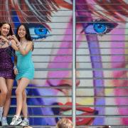 Swifties pose on Wembley Park's Taylor Swift steps during one of the Era's tour concerts this summer