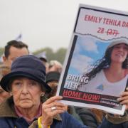 Emily Damari's image was on placards as people attend a Remembering October 7 memorial event in Hyde Park