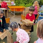 Children problem solving in the outdoor space at Tetherdown (Image: Tetherdown Primary School)