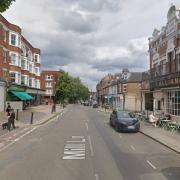 A road was closed and a forensics tent was put up after a man died in the street near a pub between Kilburn and West Hampstead.