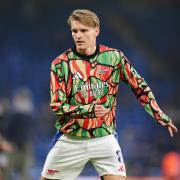 Arsenal's Martin Odegaard warms up ahead of the Premier League match at Stamford Bridge, London. Picture date: Sunday November 10, 2024.